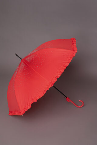 Αδιάβροχη κόκκινη ομπρέλα, με στρας και βολάν στο τελείωμα, ιδανική για να ολοκληρώσετε ένα ξεχωριστό look!